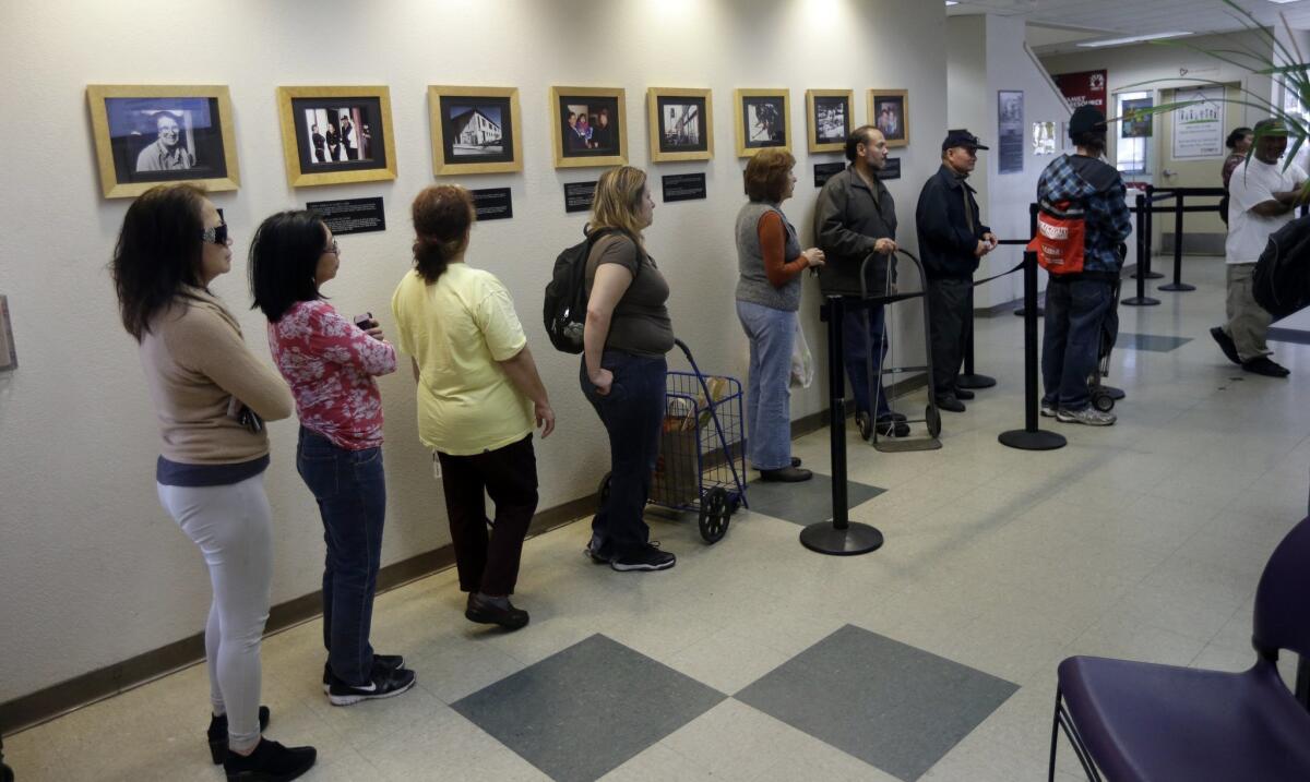 People line up at a food pantry in San Jose on Feb. 21.