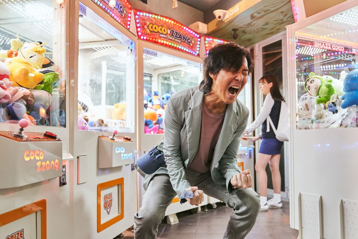 A man screams in frustration in an arcade in a scene from "Squid Game."