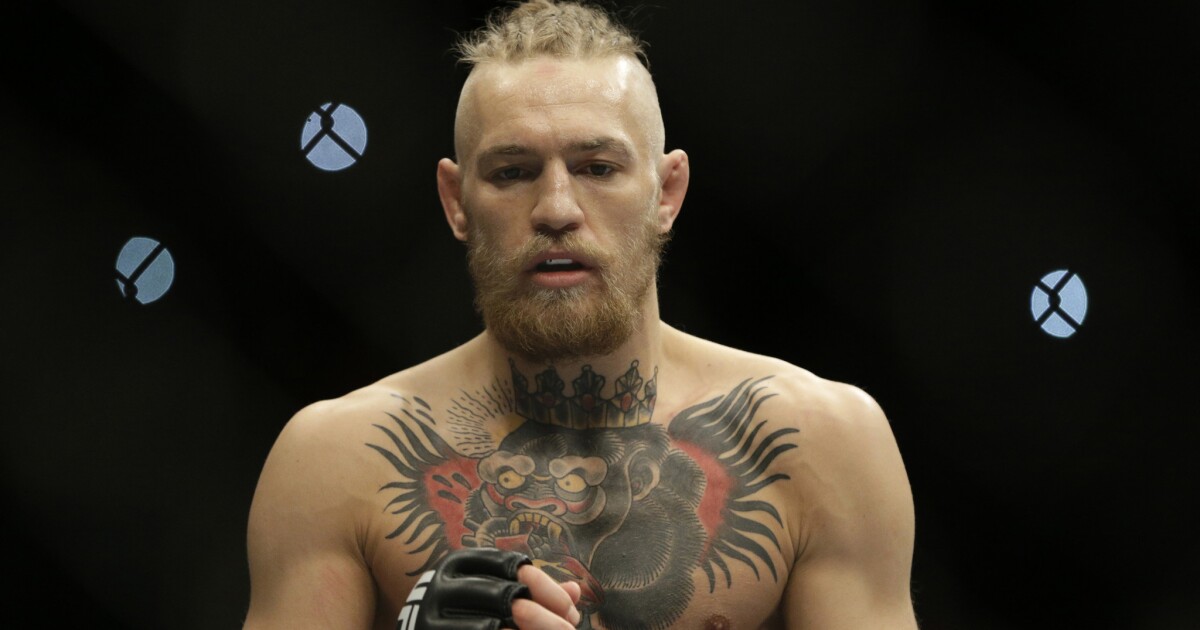 Conor McGregor snatches UFC Featherweight title from Jose Aldo at press