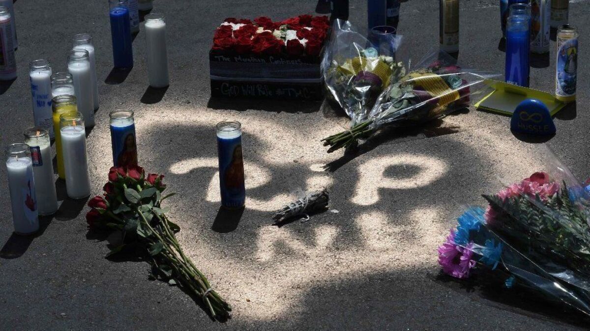 Messages left by fans at a makeshift memorial outside the Marathon clothing store owned by Grammy-nominated rapper Nipsey Hussle, where he was fatally shot Sunday.