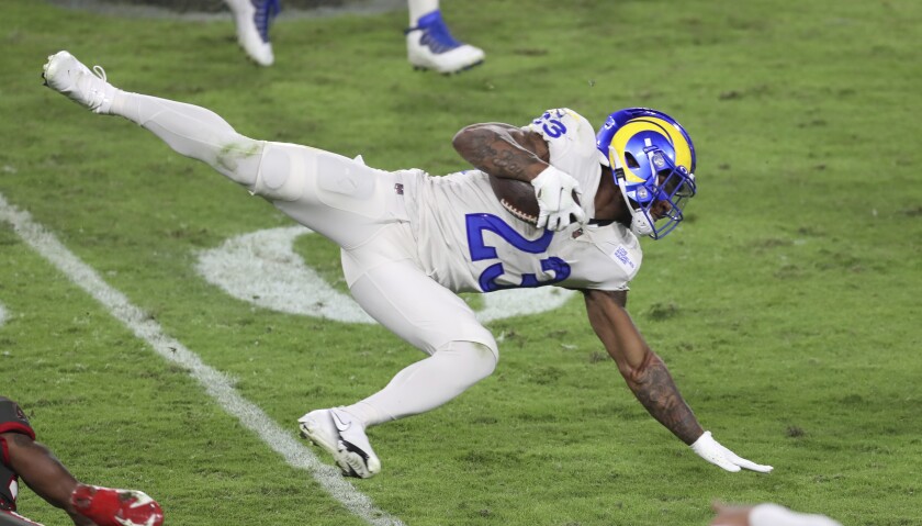 Rams running back Cam Akers stretches for more yardage.