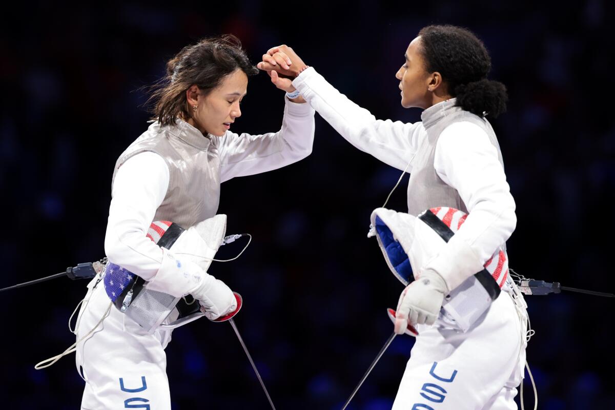 U.S. teammates Lee Kiefer, left, and Lauren Scruggs competed against one another.