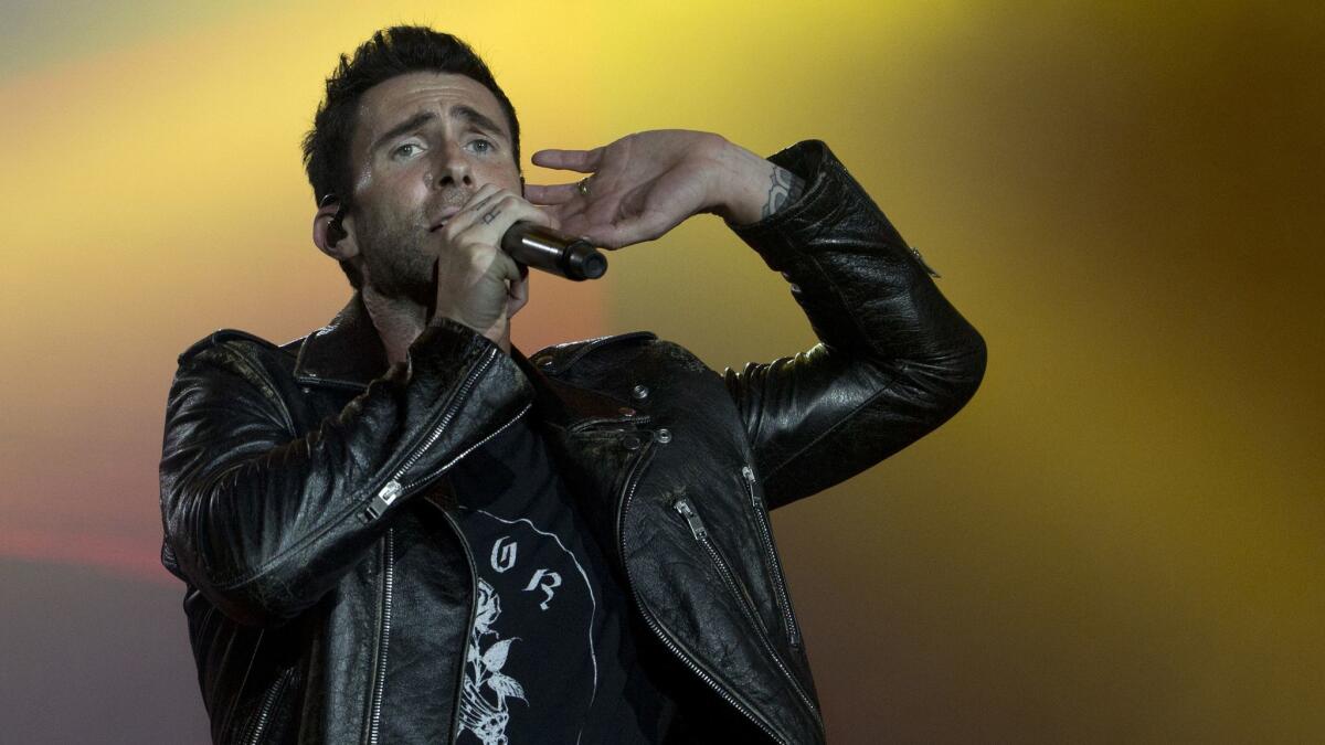 Adam Levine of Maroon 5 performs at the 2017 Rock in Rio music festival in Brazil. Big Boi and Travis Scott will perform with Maroon 5 in Sunday's Super Bowl halftime show.