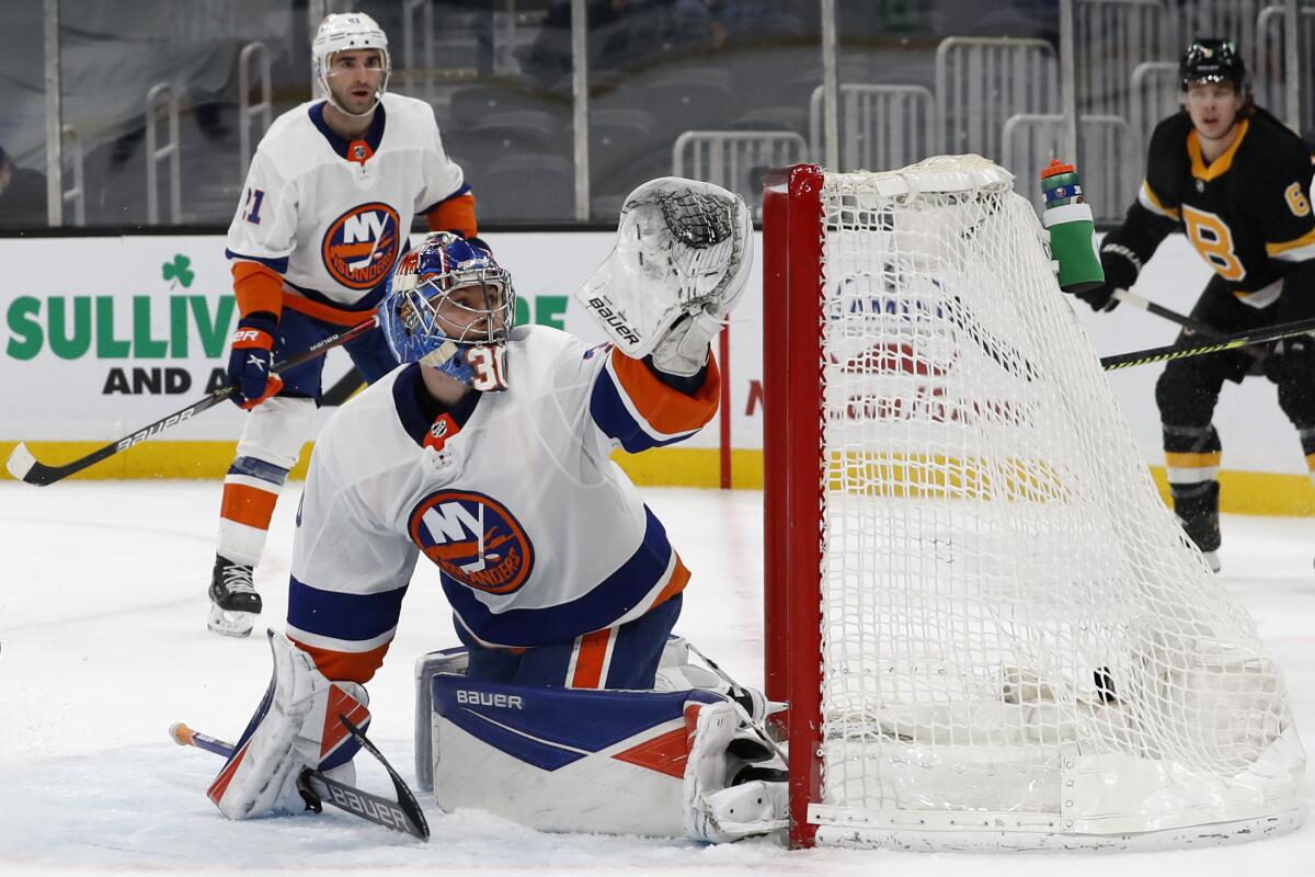 New York Islanders goaltender Ilya Sorokin can't stop a goal by Boston Bruins' David Pastrnak during the first period of an NHL hockey game Friday, April 16, 2021, in Boston. (AP Photo/Winslow Townson)