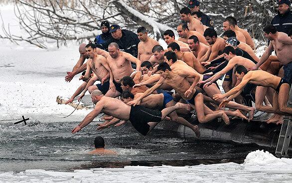 Bulgarians dive into icy water as they compete to catch a cross thrown into a lake in Sofia, the capital, on Epiphany Day. It is believed that the man who is the first to grab the cross, tossed by an Eastern Orthodox priest, will be healthy throughout the next year.