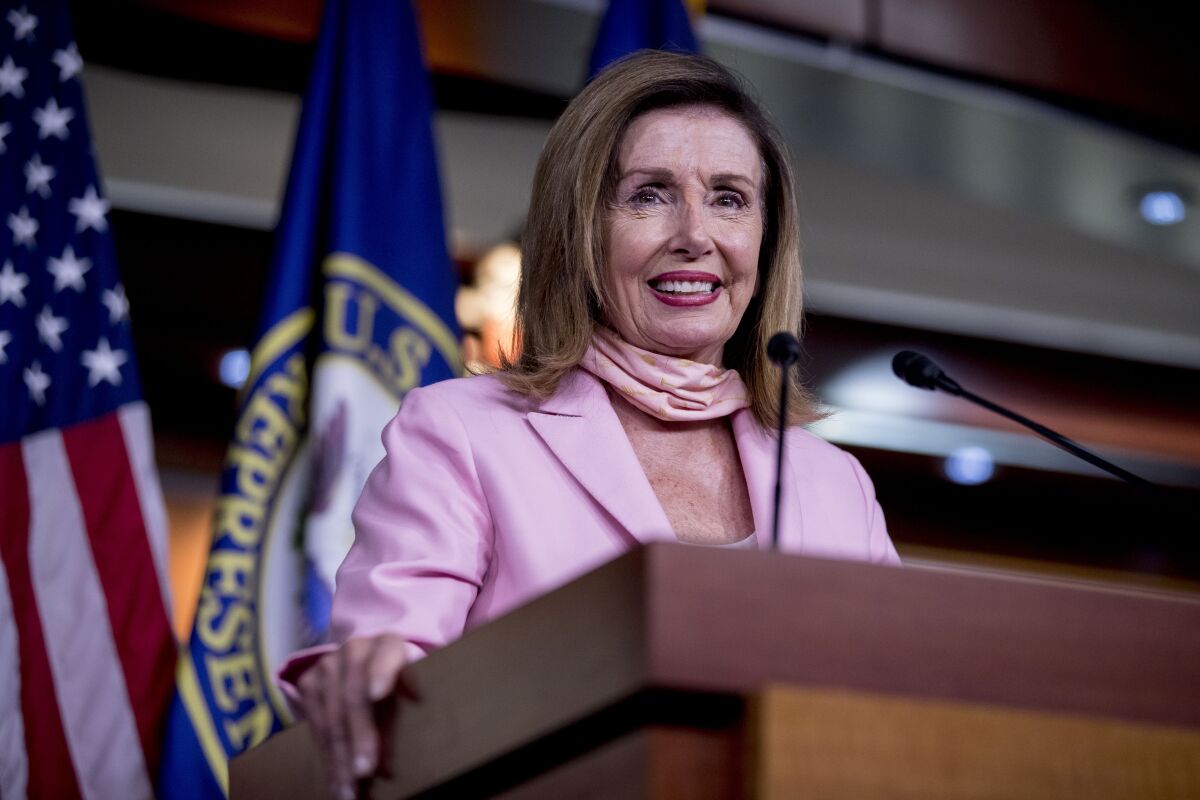 House Speaker Nancy Pelosi of Calif. smiles while speaking at a news conference on Capitol Hill in Washington, Friday, July 31, 2020. (AP Photo/Andrew Harnik)