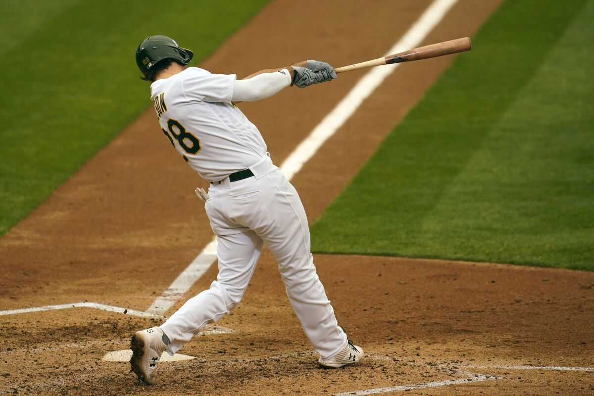 Oakland Athletics' Matt Olson hits a two-run home run against the Houston Astros during the sixth inning of a baseball game in Oakland, Calif., Thursday, Sept. 10, 2020. (AP Photo/Jeff Chiu)