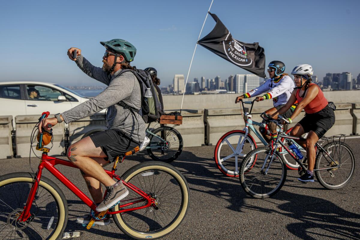 Riders peddle across the Coronado Bridge during the 16th Annual Bike the Bay on Sunday, August 24, 2023.