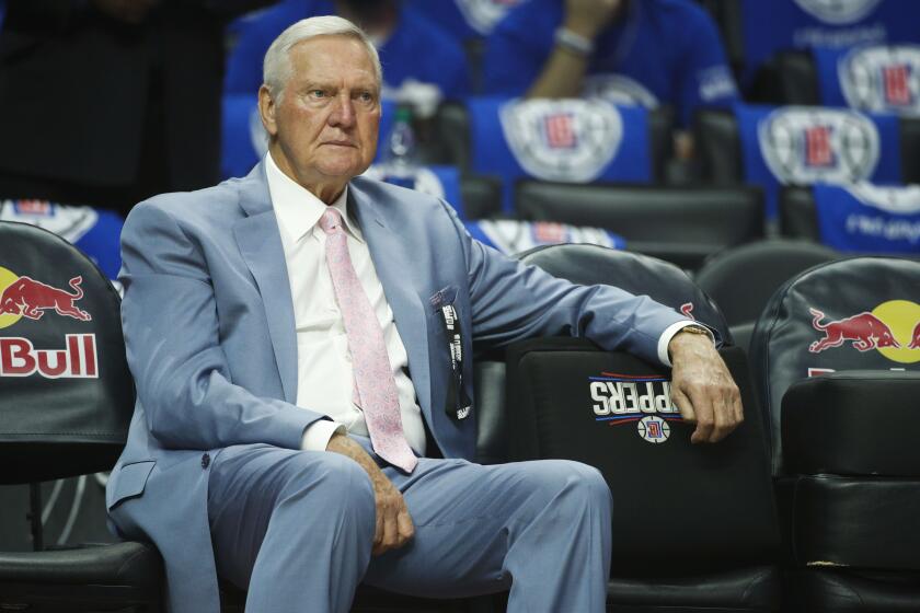 Jerry West sits on the bench before an NBA basketball game between the Los Angeles Clippers and the Phoenix Suns