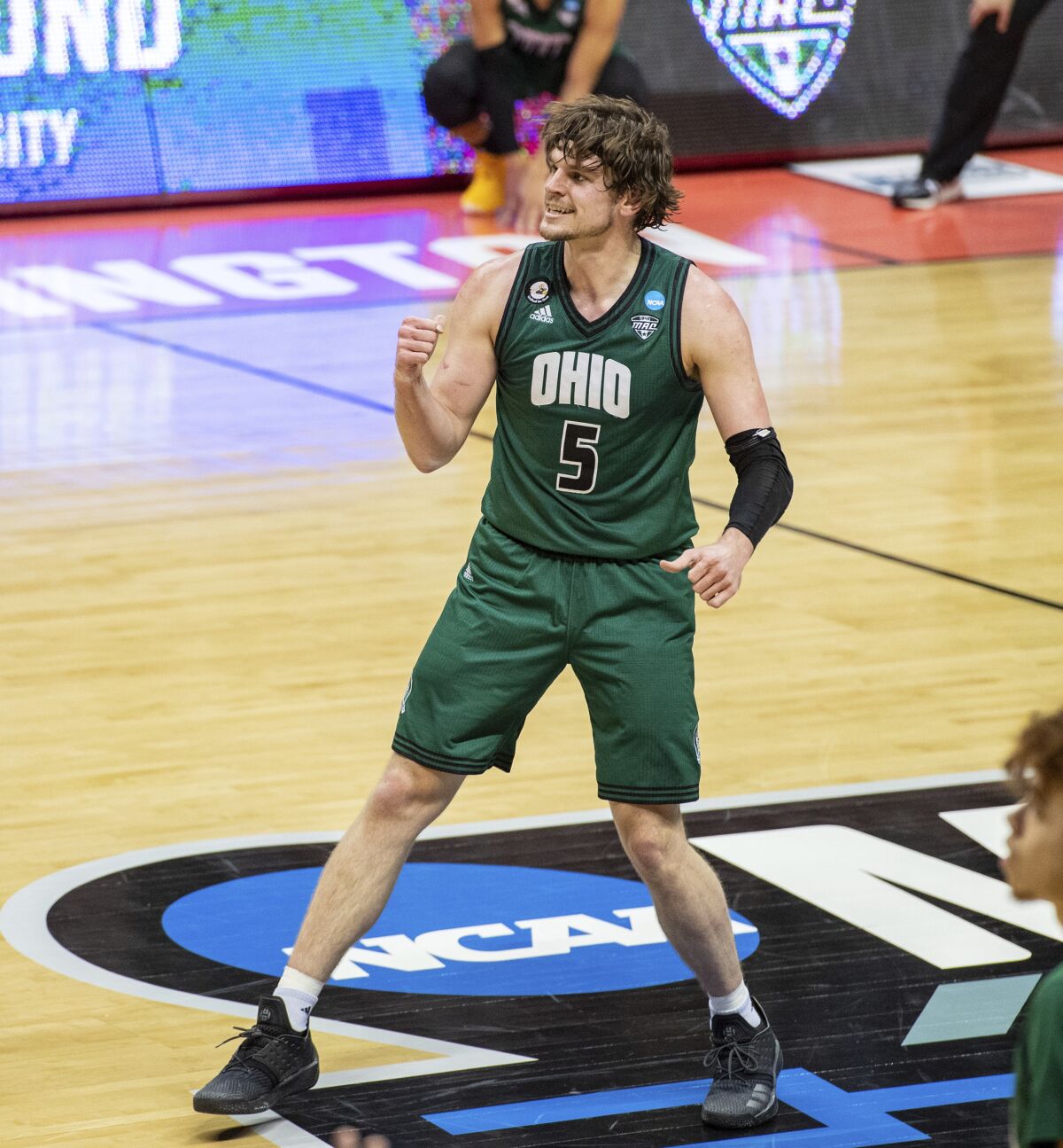 Ohio forward Ben Vander Plas celebrates after making a three-pointer during the first half against Virginia on Saturday.