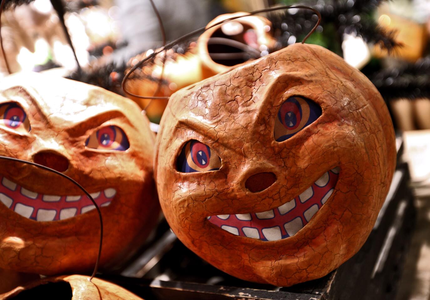 Chuckling pumpkins are on display at Roger’s Gardens for the "Malice in Wonderland" Halloween boutique.