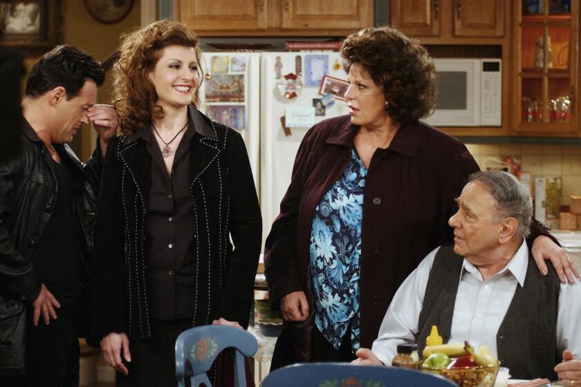 FILE - Cast members, from left, Louis Mandylor, Nia Vardalos, Lainie Kazan and Michael Constantine, of the new CBS comedy series "My Big Fat Greek Life," based on the hit film "My Big Fat Greek Wedding," rehearse a scene on the set in Los Angeles on Feb. 14, 2003. Constantine, an Emmy Award-winning character actor who reached worldwide fame playing the Windex bottle-toting father of the bride in the 2002 film “My Big Fat Greek Wedding,” died Aug. 31 in his home at Reading, Pennsylvania, of natural causes. He was 94. (AP Photo/Rene Macura, File)