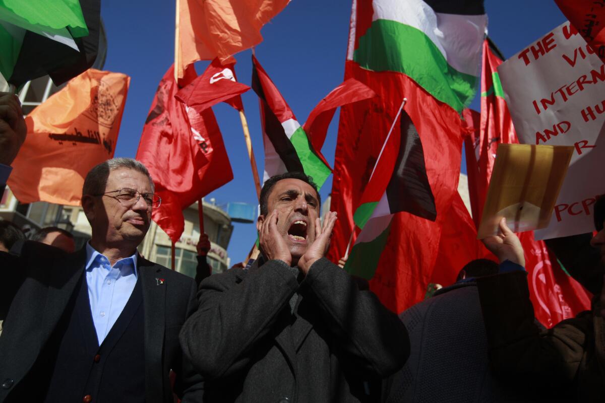 Palestinians demonstrate against U.S. Secretary of State John F. Kerry in the West Bank city of Ramallah.