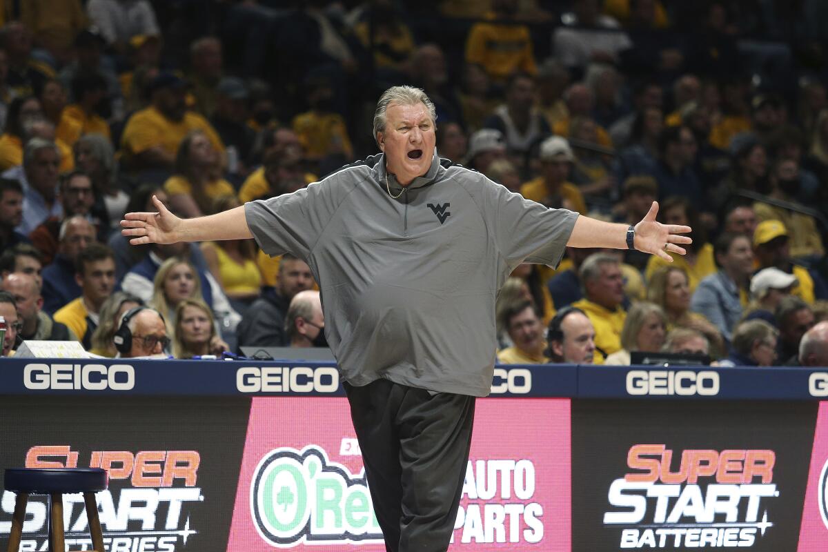 West Virginia coach Bob Huggins reacts during the first half of an NCAA college basketball game against Pittsburgh in Morgantown, W.Va., Friday, Nov. 12, 2021. (AP Photo/Kathleen Batten)