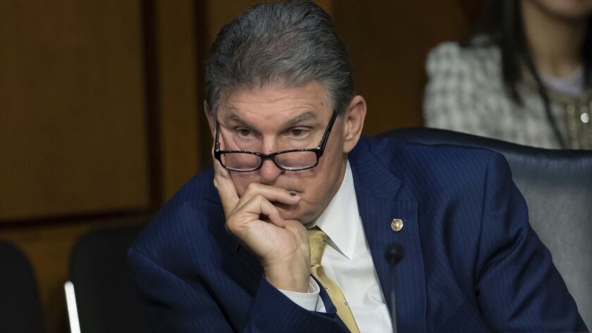 Sen. Joe Manchin III (D-W.Va.), shown at a Senate Intelligence Committee hearing in Washington in 2018, has called on the Senate to pass a resolution censuring President Trump for his actions on Ukraine.