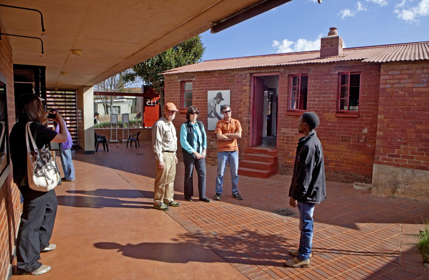Tourists from the U.S. visit the Nelson Mandela house on Vilakazi Street that is now a museum in Soweto, South Africa. It is one of the biggest tourist attractions in the area. The Mandelas lived here in the 1960s before Nelson was imprisoned.