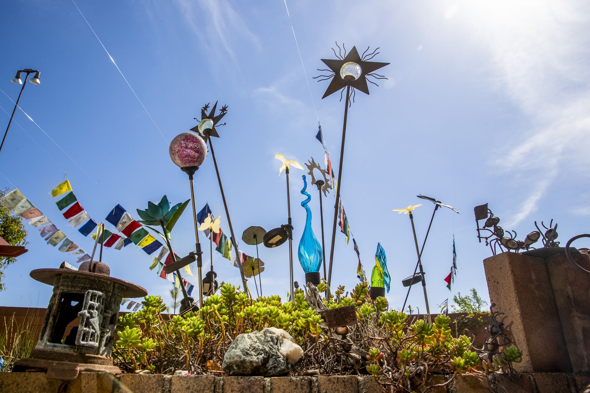 Glass sculptures clustered in a garden