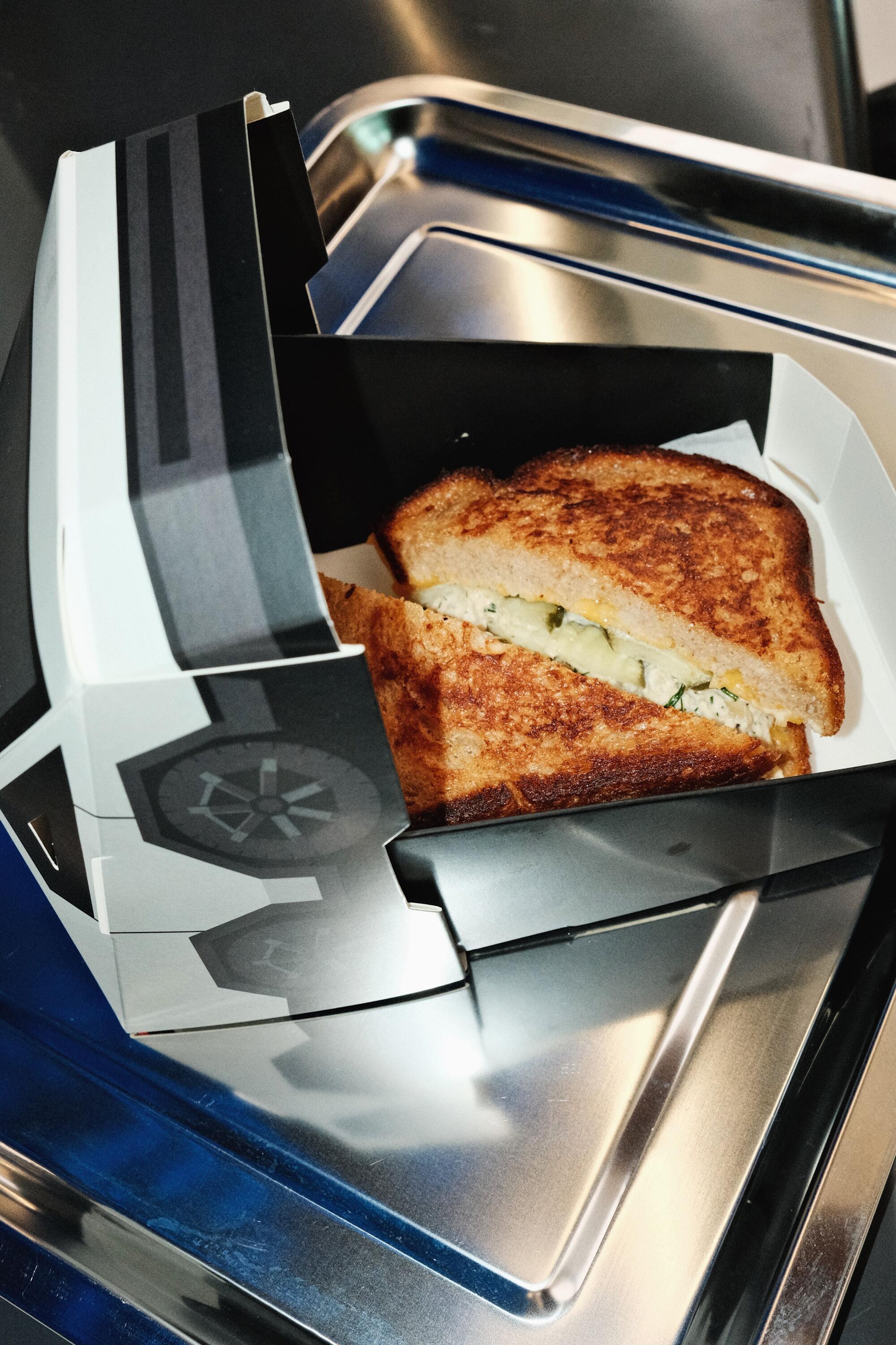 The tuna melt at Tesla Diner comes served in a paper Cybertruck.