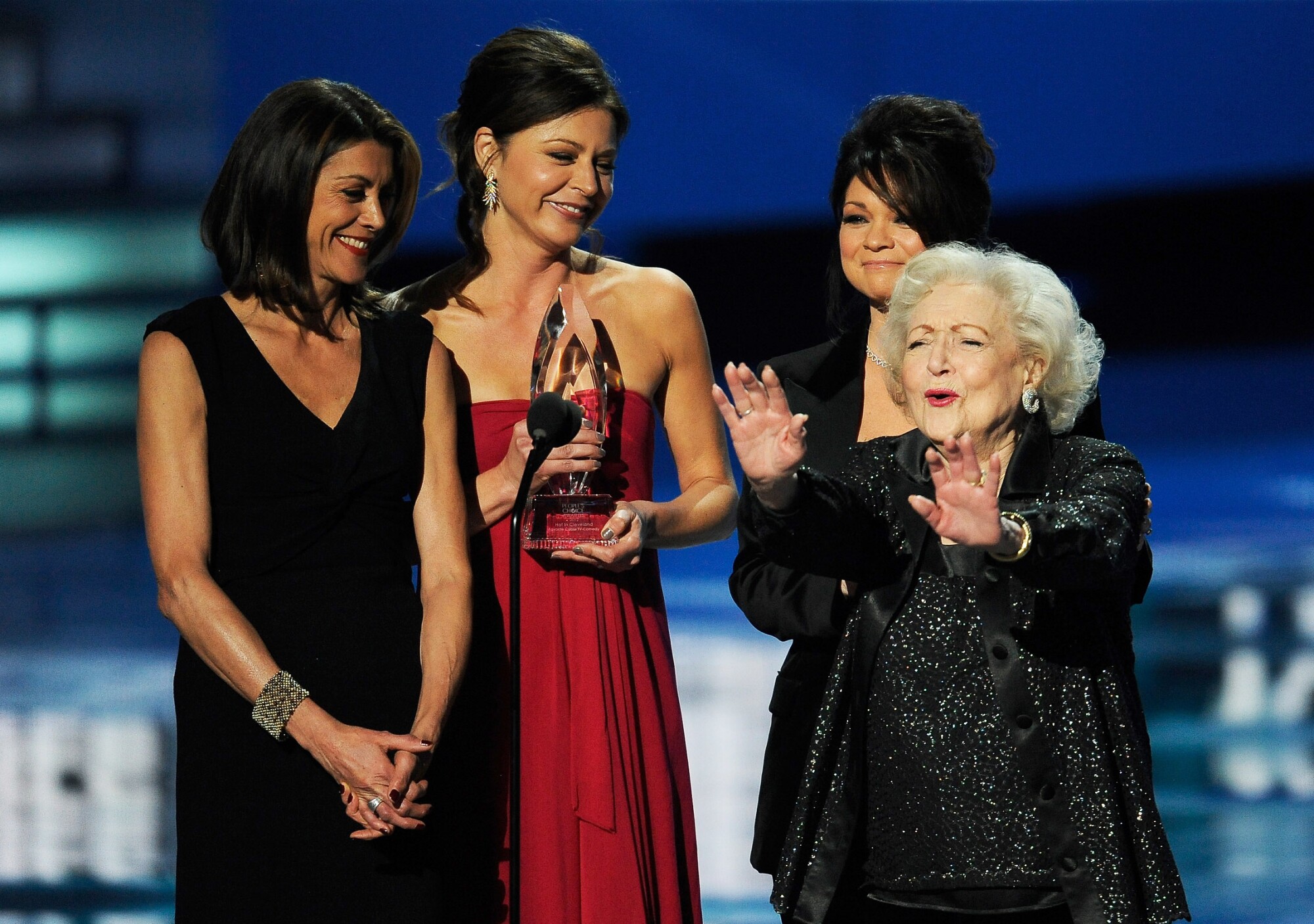 From left to right, Wendie Malick, Jane Leeves, Valerie Bertinelli and Betty White accept an award.