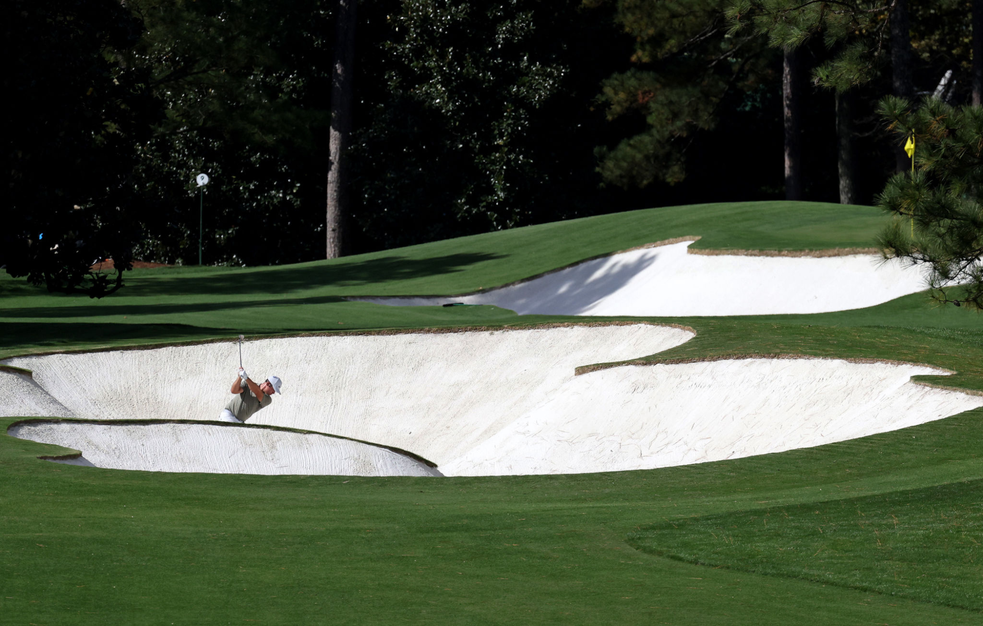 Paul Casey plays a shot from a bunker on the first hole at Augusta National Golf Club.