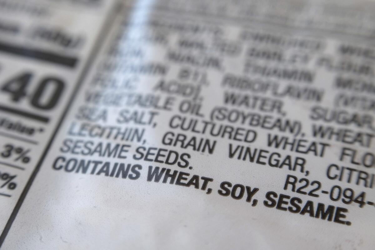 "Contains wheat, soy, sesame" printed under the ingredient list on a food package 