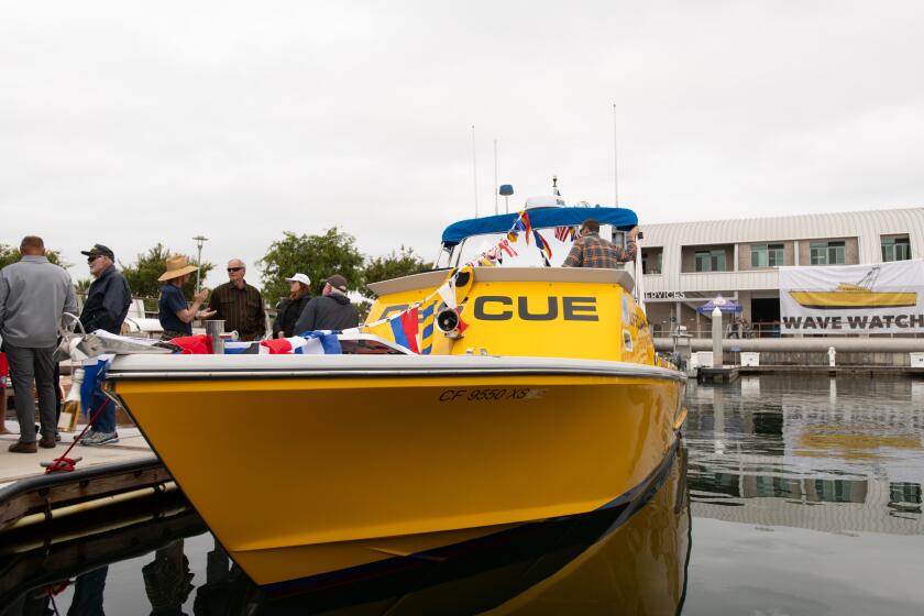 The Wave Watch, a new rescue vessel for Laguna Beach marine safety, sits moored in Newport Bay during a christening ceremony.