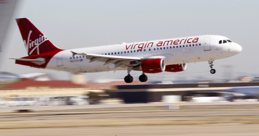 A Virgin America plane lands at Dallas Fort Worth International Airport in December 2010.