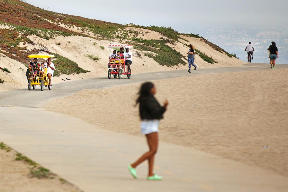 PLAYA DEL REY, CA - JUNE 20: A people and families spend Father's Day at Dockweiler Beach on Sunday, June 20, 2021 in Playa Del Rey, CA. (Jason Armond / Los Angeles Times)