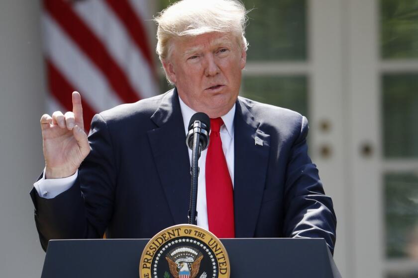 FILE - In this Thursday, June 1, 2017 file photo, President Donald Trump speaks about the U.S. role in the Paris climate change accord in the Rose Garden of the White House in Washington. The Trump Administration is officially telling the United Nations that the U.S. intends to pull out of the 2015 Paris climate agreement. The State Department made the announcement late Friday afternoon, Aug. 4, 2017. (AP Photo/Pablo Martinez Monsivais, File)