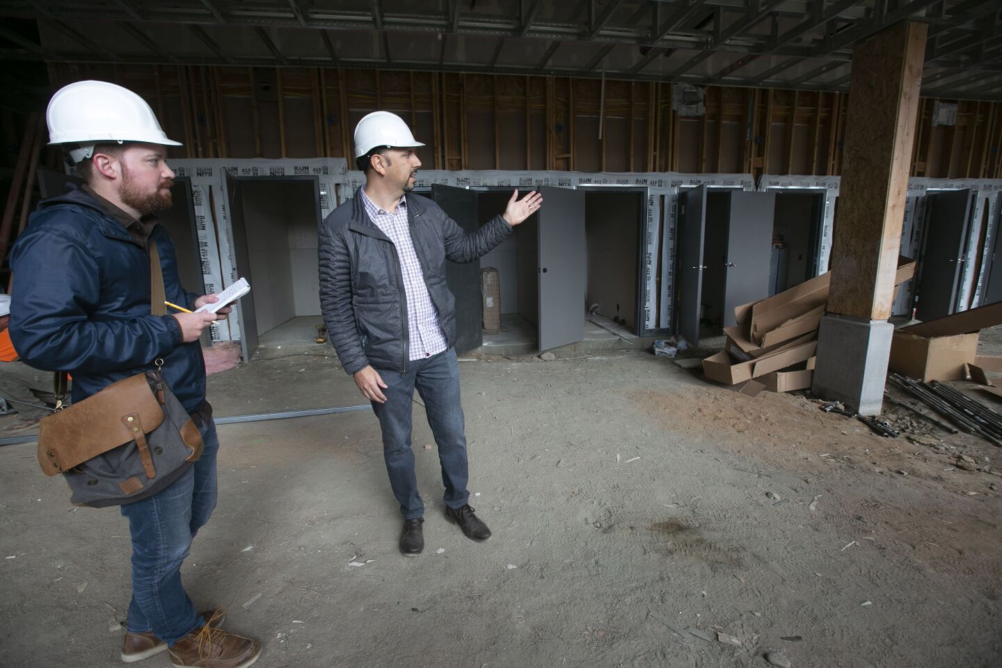 Beri Varol, right, the architect and developer of the Kansas Modern apartments on Kansas Street and Howard Avenue in North Park, with Union-Tribune Real Estate reporter Phil Molnar, left, on Thursday, January 09, 2020.