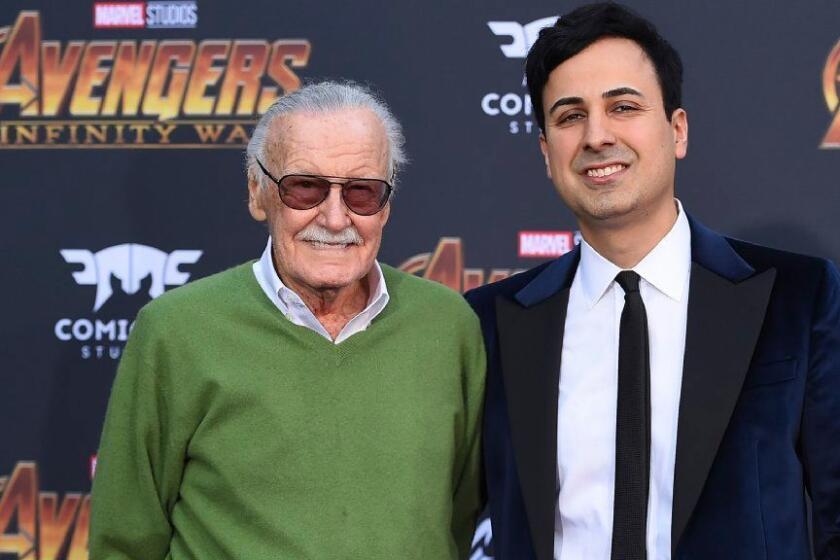 FILE - In this April 23, 2018, file photo, Stan Lee, left, and Keya Morgan arrive at the world premiere of "Avengers: Infinity War" in Los Angeles. Morgan, the former business manager of Lee has been arrested on elder abuse charges involving the late comic book icon. Los Angeles police say Morgan was taken into custody in Arizona early Saturday, May 25, 2019, on an outstanding arrest warrant. Morgan was charged earlier this month with felony allegations of theft, embezzlement, forgery or fraud against an elder adult, and false imprisonment of an elder adult. (Photo by Jordan Strauss/Invision/AP, File)