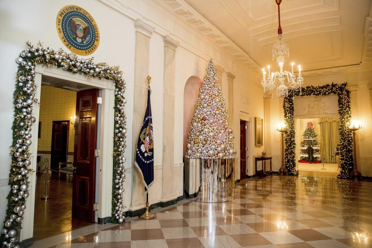 Cross Hall is decorated with mirrored ornaments and garlands.