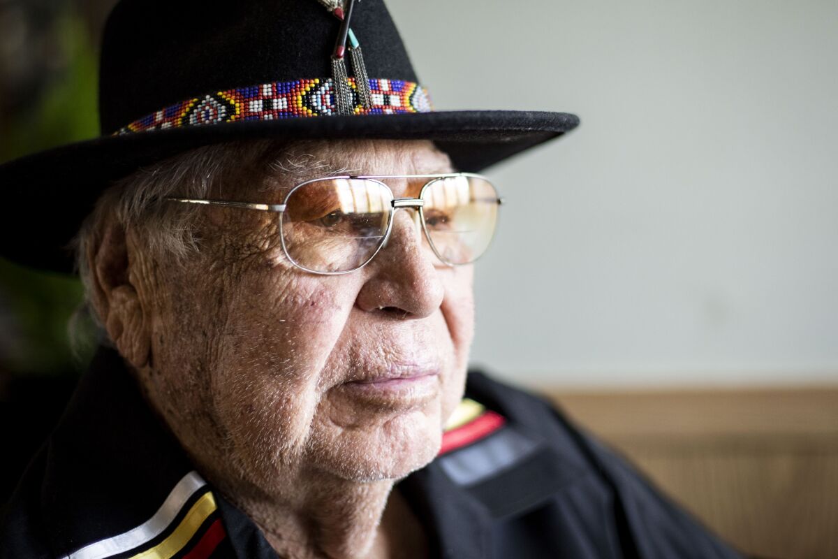A tribal elder from the Kiowa and Caddo tribes talks to a journalist.