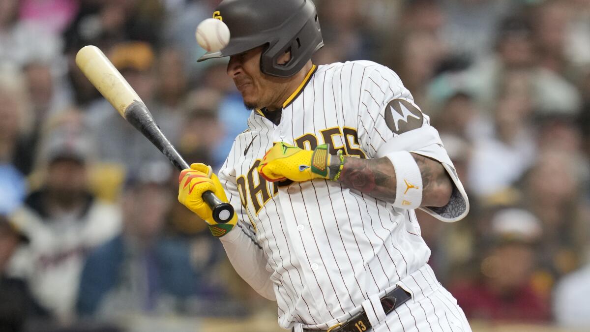 Padres slugger Manny Machado exits game after getting hit by pitch on left  hand