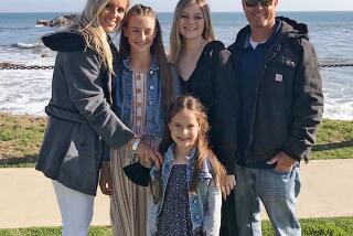 Undated handout photo of Tory Carlon, right, wis wife, Heidi, and their daughters.