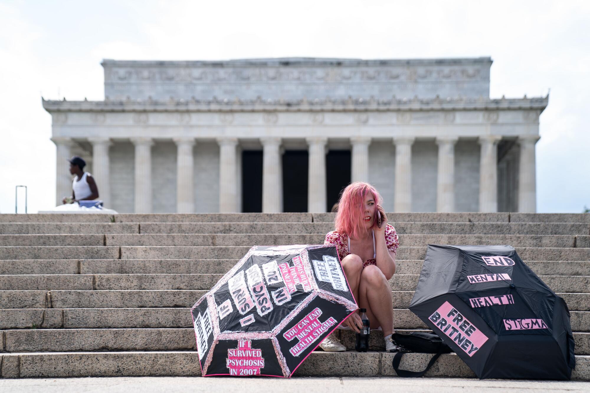Melanie Carlson, 39, of Washington, D.C., sits on the steps leading to the Lincoln Memorial.