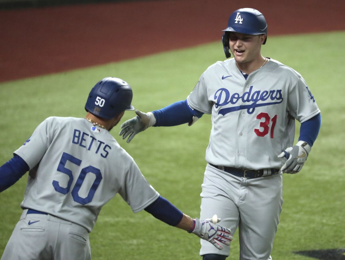 Joc Pederson crosses home plate after homering in the second inning of Game 5.