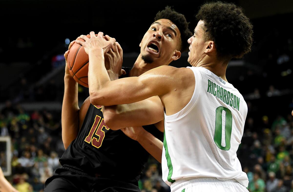 USC's Isaiah Mobley, left, tries to put up a shot over Oregon's Will Richardson on Jan. 23.