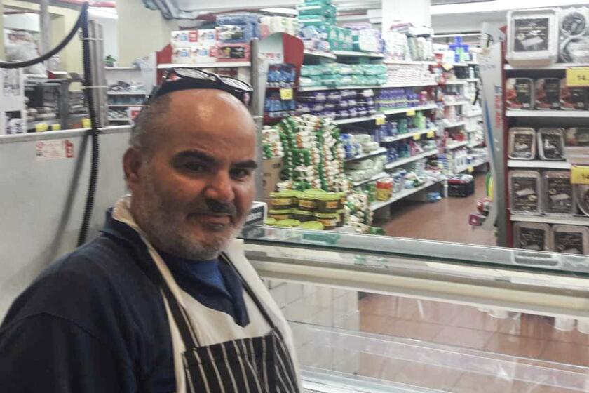 This 2021 photo provided by Haim Parag shows David Ben-Avraham at a supermarket in the Israeli town of Beit Shamesh, where he briefly worked, in Jerusalem. Ben-Avraham, a Palestinian who was born a Muslim but made the almost unheard-of decision to convert to Judaism years earlier, was fatally shot by an Israeli soldier. (Courtesy of Haim Parag via AP)