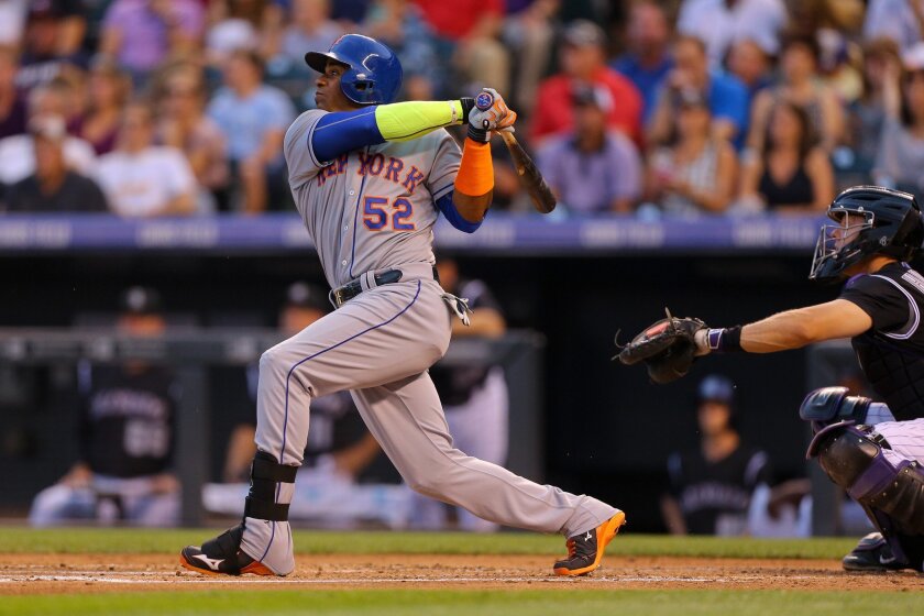 New York Mets' Yoenis Cespedes hits a grand slam against the Colorado Rockies on Aug. 21. The Angels won't say whether they are in the mix for the free agent.