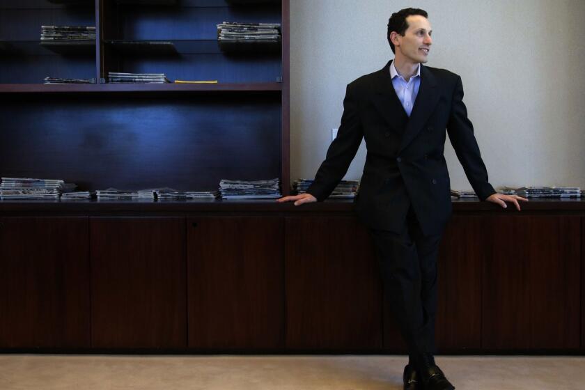 Aaron Kushner, publisher of The Orange County Register, pauses for photos in his office in Santa Ana, Calif., Thursday, Dec. 27, 2012. After years of demoralizing layoffs, one newspaper is trying something novel: hiring more reporters. The Orange County Registers new owner thinks the way to turn the paper around is through better reporting to lure new and former readers to a revived product. (AP Photo/Jae C. Hong) ** Usable by LA and DC Only **