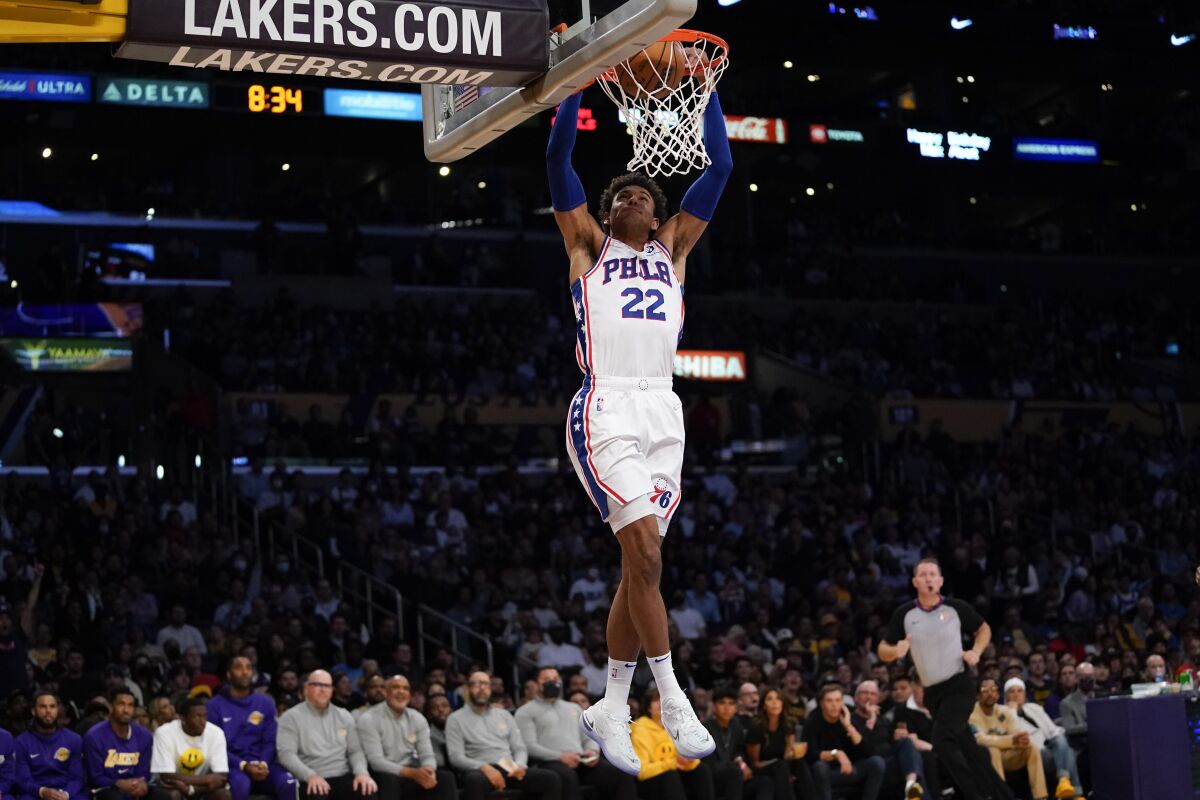 Philadelphia 76ers guard Matisse Thybulle (22) dunks during the second half of an NBA basketball game against the Los Angeles Lakers in Los Angeles, Wednesday, March 23, 2022. (AP Photo/Ashley Landis)