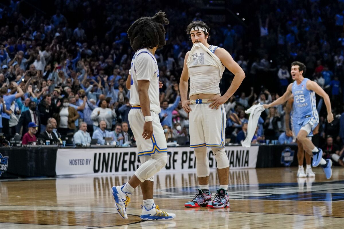 UCLA guard Tyger Campbell, left, and guard Jaime Jaquez Jr. react in the final seconds.