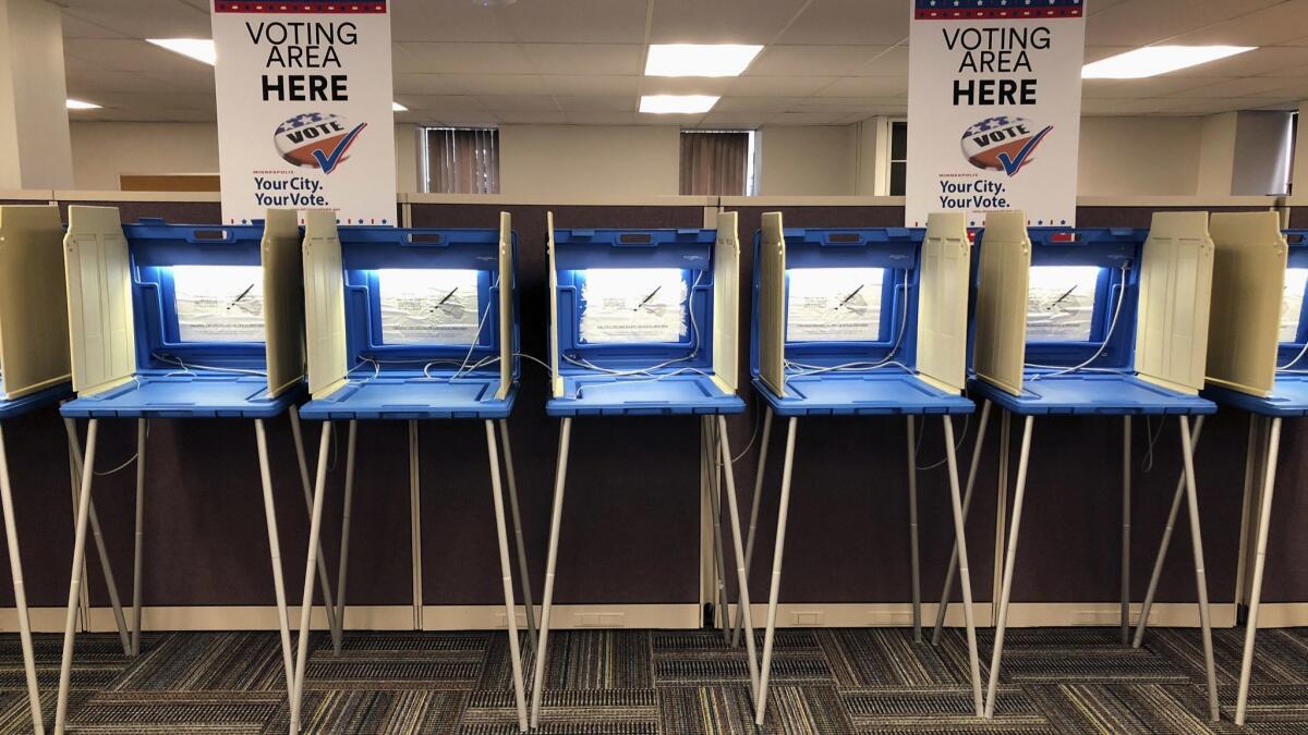 Voting booths stand ready for early voting in Minneapolis, Minn. on Sept. 20.