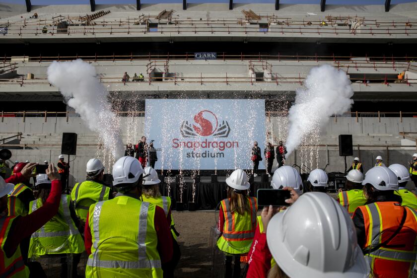 San Diego, CA - December 06: The new stadium name is revealed at a ceremony where officials from San Diego State University and Qualcomm announced a $45 million, 15-year deal to name the school's new Mission Valley football stadium Snapdragon Stadium on Monday, Dec. 6, 2021 in San Diego, CA. (Sam Hodgson / The San Diego Union-Tribune)