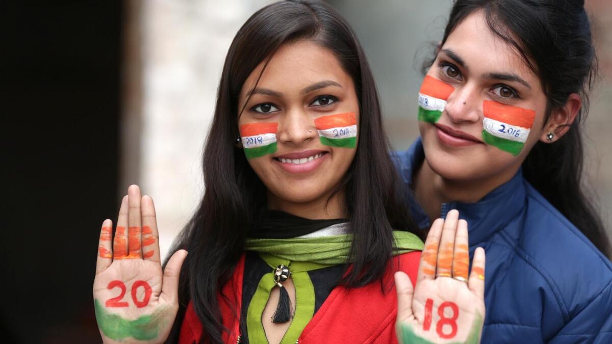 Indian girls with painted faces welcome the new year in Amritsar.