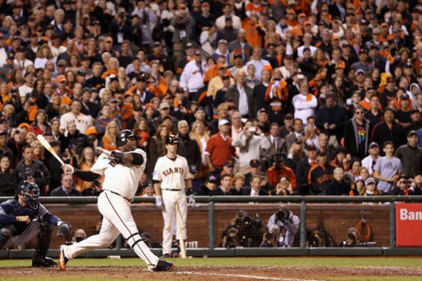 The San Francisco Giants' Pablo Sandoval singles against the Detroit Tigers' Al Albuquerque during Game 1 of Major League Baseball's World Series on Wednesday.