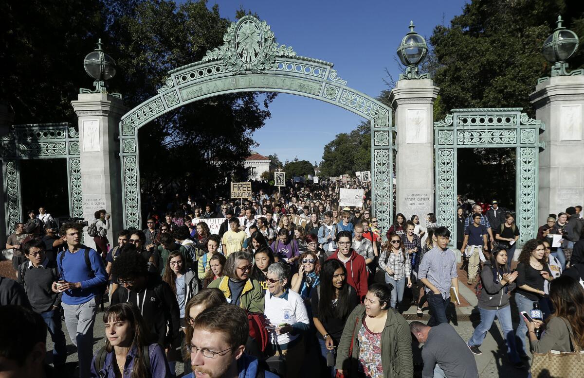 Students march under Sather Gate during a protest about tuition increases at UC Berkeley in November.
