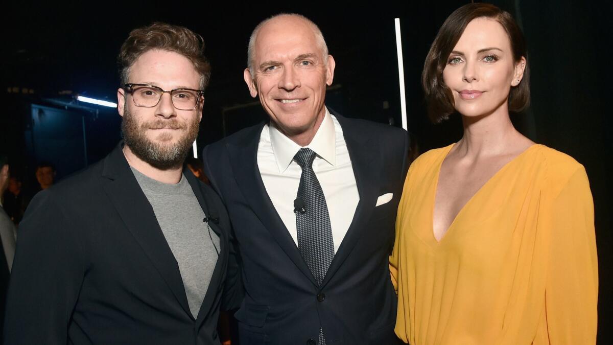 Seth Rogen, Lionsgate Motion Picture Group Chairman Joe Drake and Charlize Theron at CinemaCon 2019 at the Colosseum at Caesars Palace in Las Vegas.