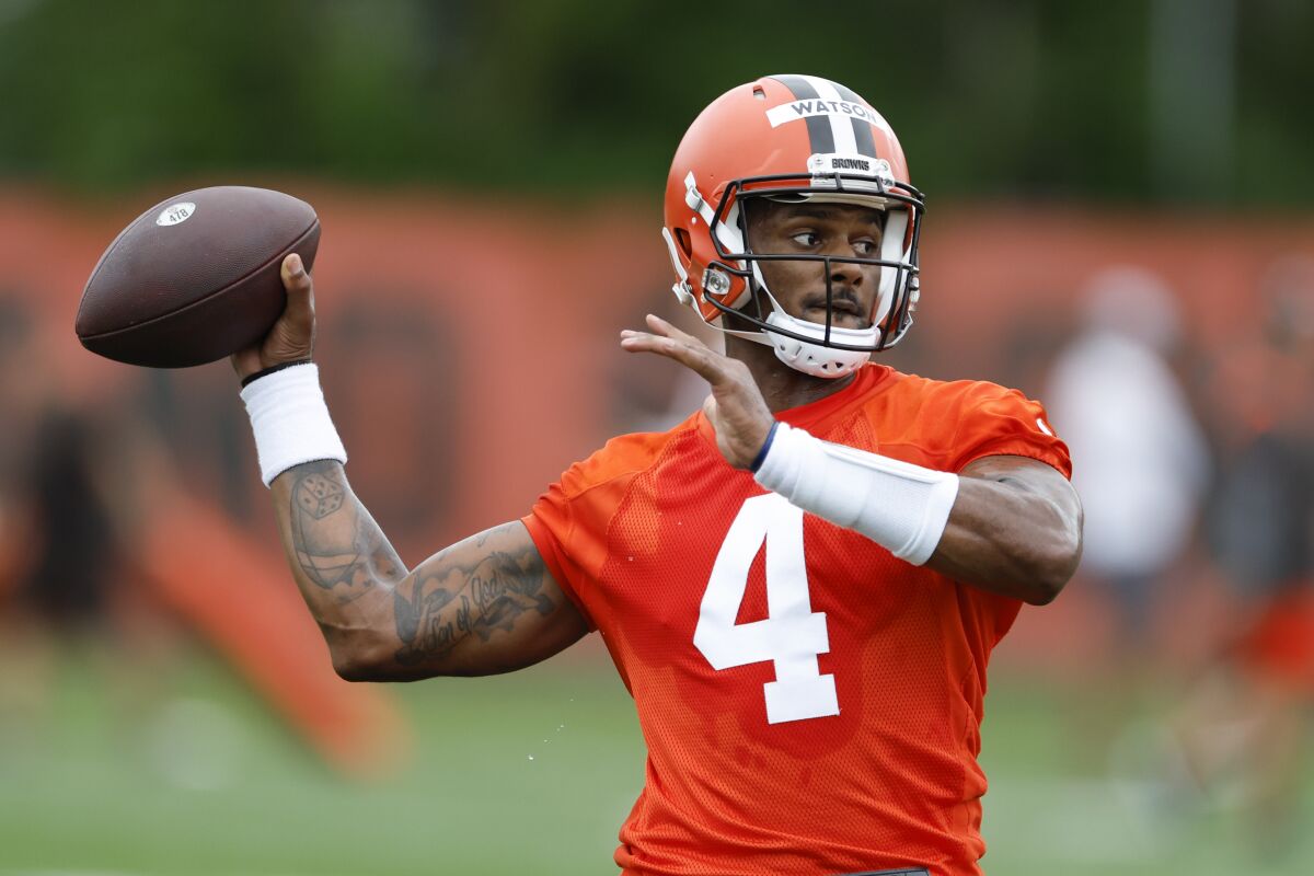 FILE - Cleveland Browns quarterback Deshaun Watson takes part in drills at the NFL football team's practice facility Tuesday, June 14, 2022, in Berea, Ohio. Watson reported to his first training camp with the Browns on Friday, July 22, 2022, still not knowing how long he'll be their starting quarterback. (AP Photo/Ron Schwane, File)